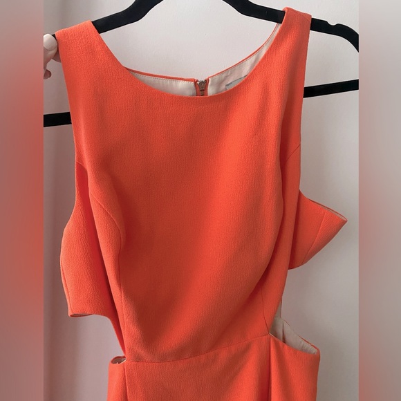 Beautiful size small peach dress with cut outs. - Picture 1 of 5